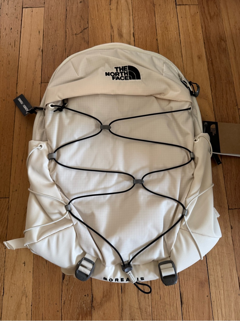 The North Face Off-White Backpack with Black Bungee